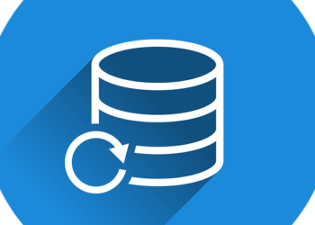 White stacked database cylinder with a circular restore arrow on a blue round background representing Ultimate website backup service: Protect your site with ease!