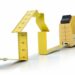 Yellow tape measure folded into a house shape on a white background illustrating measurement-driven growth to Unlock Your Website’s Potential with Continuous Improvement Strategies.