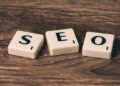 Three Scrabble-style tiles spelling SEO on a wooden surface illustrating Unlock Lightning-Fast Website Performance: 10 Must-Know Tips